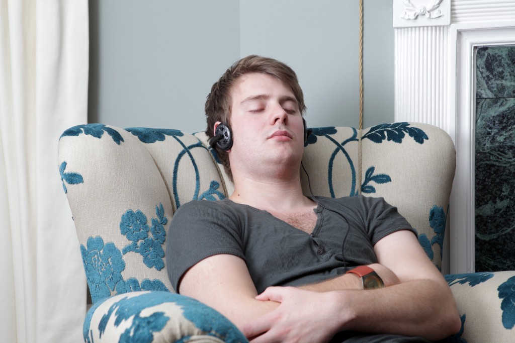 relaxing sleeping in chair headphones